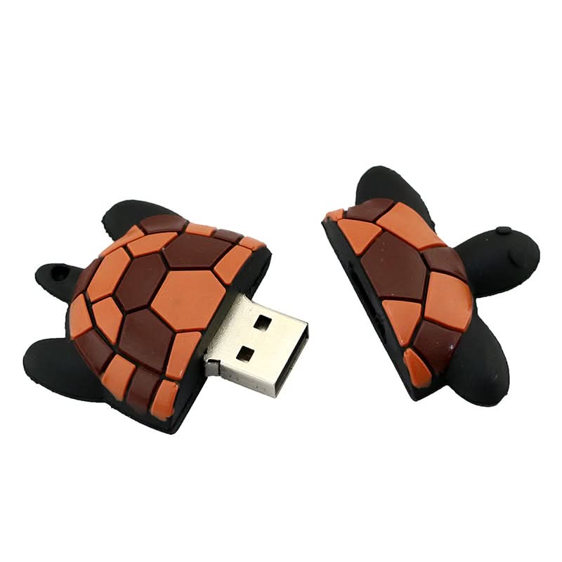 Pen drive USB a forma di tartaruga in stile cartoon, guscio mosaico arancione/marrone.