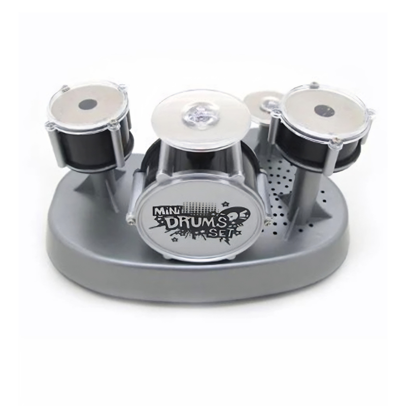 Mini batteria giocattolo per dita con 4 tamburi su base grigia