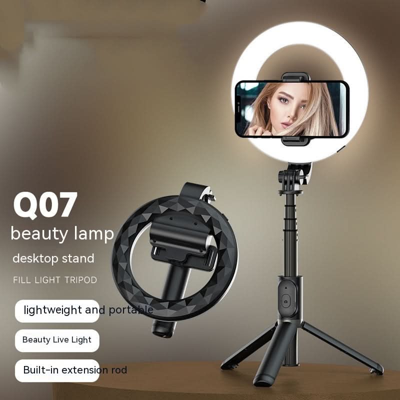 Luce LED ad anello per selfie Bluetooth Q07 nera su treppiede desktop con supporto per telefono.