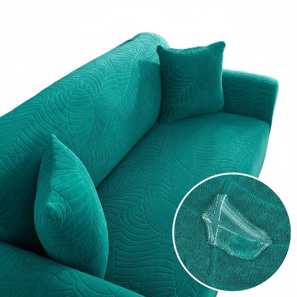 Copridivano elastico all-inclusive verde bluastro con motivo a foglie.