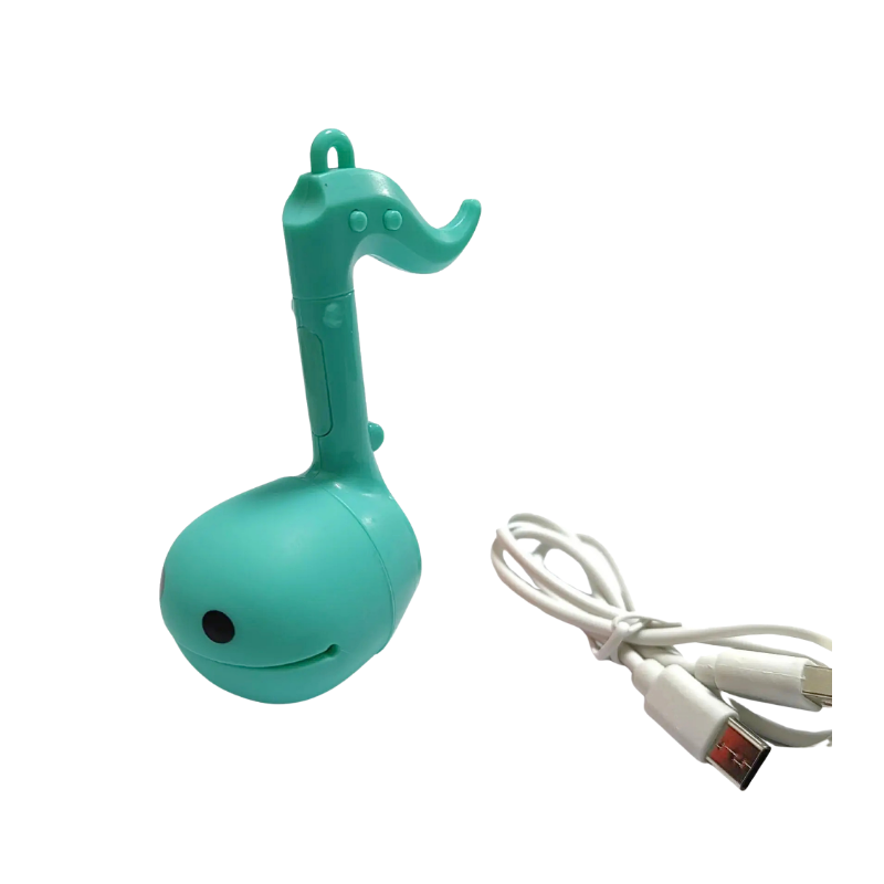 Mini otamatone elettronico verde a forma di nota musicale con ricarica USB, strumento musicale creativo e giocattolo sonoro.