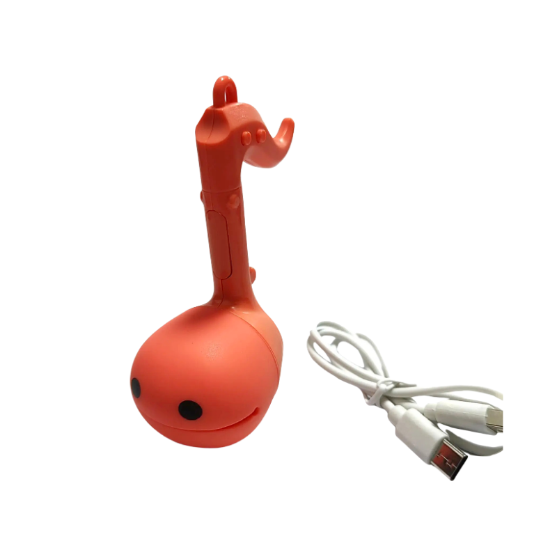 Ottamatone Mini arancione con cavo USB, strumento musicale elettronico creativo in plastica e silicone, perfetto per relax e musicalità.