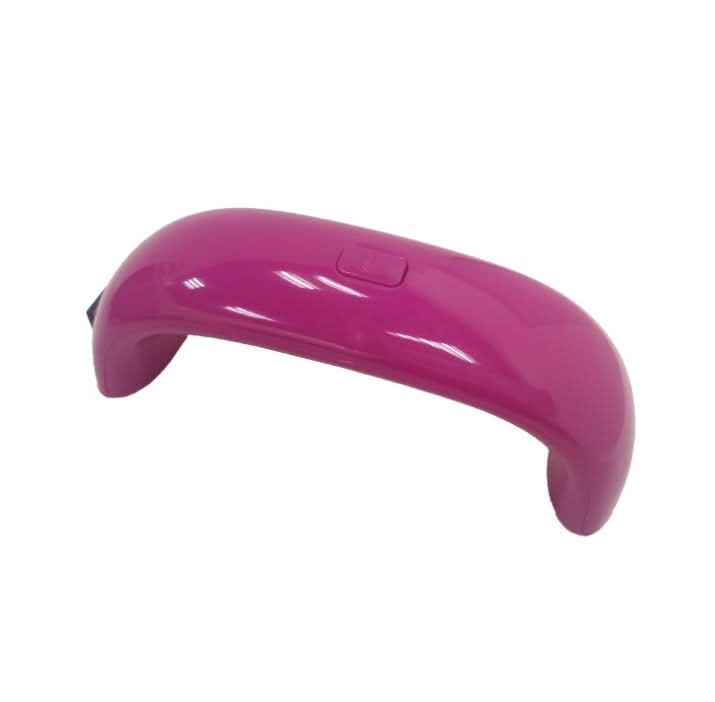 Lampada UV LED USB portatile per unghie, colore rosa, design curvo con pulsante.