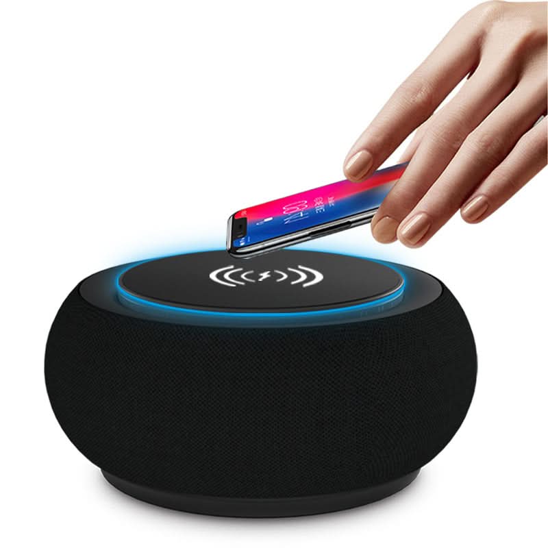 Altoparlante Bluetooth wireless rotondo nero con ricarica wireless sul top e anello LED blu