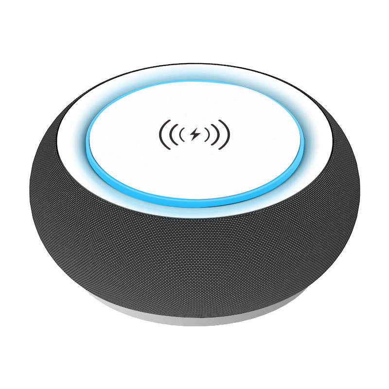 Altoparlante Bluetooth rotondo con tessuto scuro e anello blu luminoso sulla parte superiore bianca