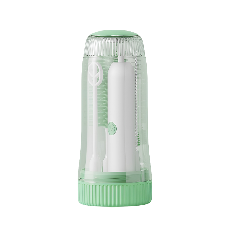 Set pulizia elettrica baby con spazzole per biberon e tettarelle, custodia trasparente verde e sterilizzazione UV integrata.
